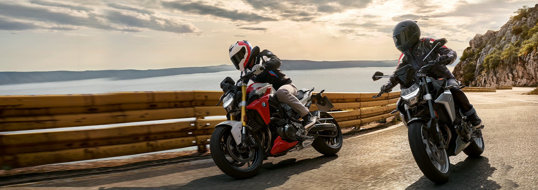 BMW Motorcycles near a beach.