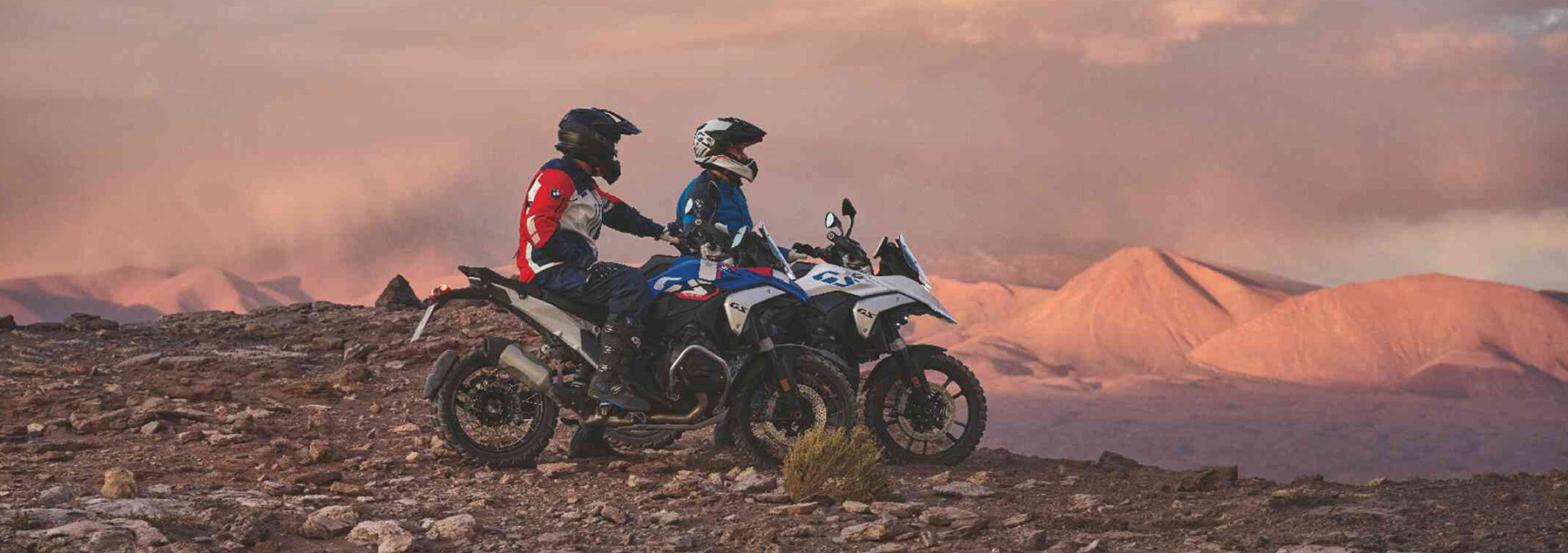 Two BMW Motorcycles on a mountain.