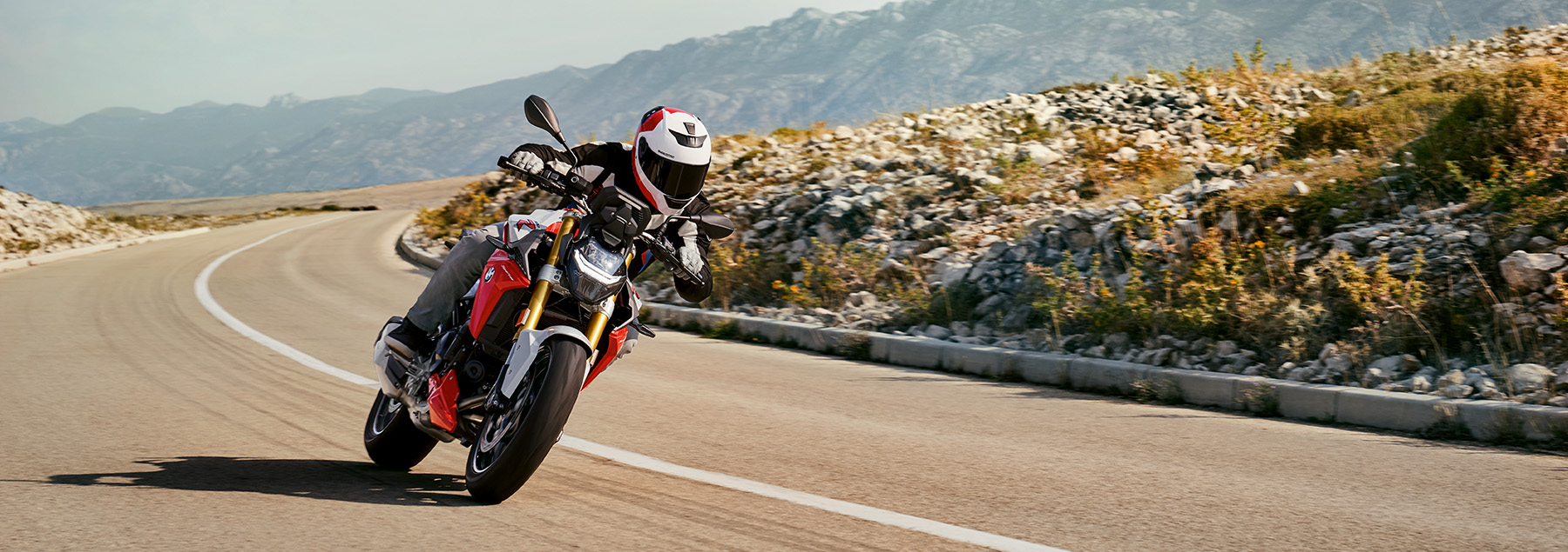 A BMW Motorcycle riding to a lighthouse in Northern California.